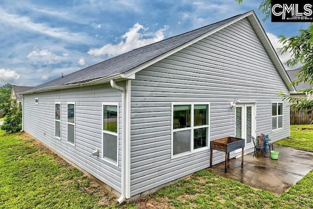 1817 Crystal Ln, West Columbia, SC 29170 - view of home's exterior with a patio and a lawn