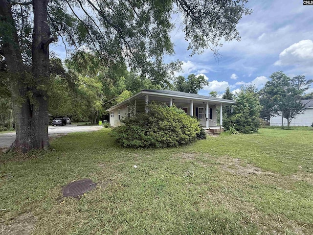 4200 Bluff Rd, Columbia, SC 29209 - view of side of home with covered porch and a lawn