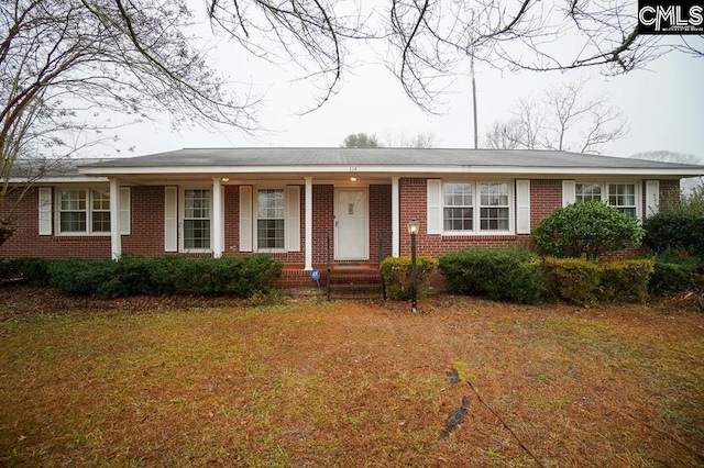 114 Robinson, North, SC 29112 - ranch-style home featuring brick siding, covered porch, and a front yard