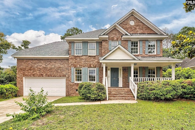 18 Ridgetop Ct, Columbia, SC 29229 - view of front of home featuring brick siding, concrete driveway, a front lawn, and covered porch