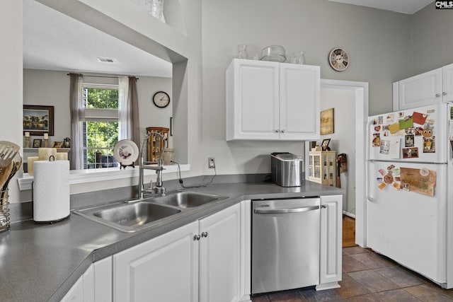 115 Black Creek Ln, Irmo, SC 29063 - kitchen with freestanding refrigerator, stainless steel dishwasher, white cabinets, and dark countertops
