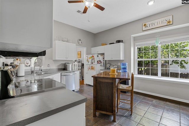 115 Black Creek Ln, Irmo, SC 29063 - kitchen with dishwasher, freestanding refrigerator, a ceiling fan, and white cabinets
