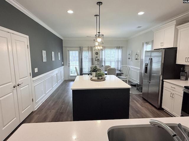 122 Tannery Way, Lexington, SC 29073 - kitchen featuring a decorative wall, wainscoting, dark wood-style floors, white cabinets, and crown molding