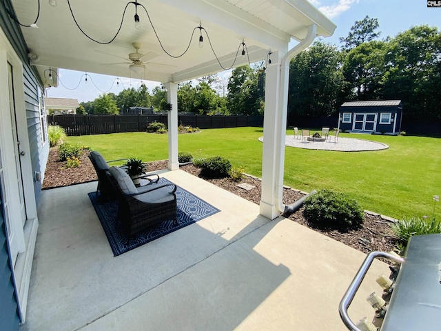122 Tannery Way, Lexington, SC 29073 - fenced backyard with a patio, ceiling fan, an outdoor structure, and a fire pit