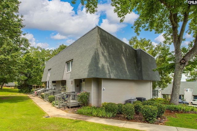 301 Harbor Heights Dr Unit 17D, Lexington, SC 29072 - view of side of property featuring a lawn, roof with shingles, mansard roof, and a porch