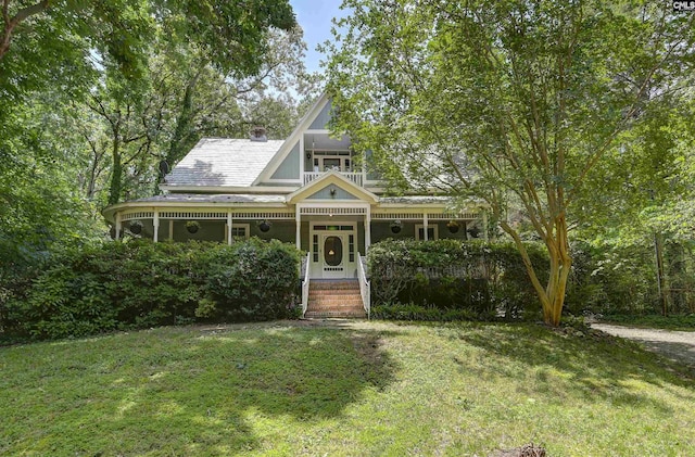 1208 Peacehaven Rd, Chapin, SC 29036 - victorian house with a front lawn, a chimney, and a balcony