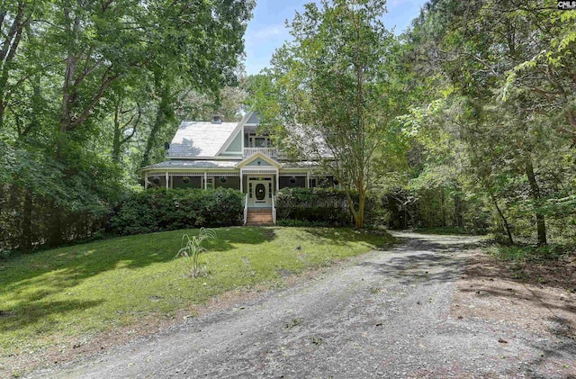 1208 Peacehaven Rd, Chapin, SC 29036 - view of front facade with a front lawn, driveway, and a chimney