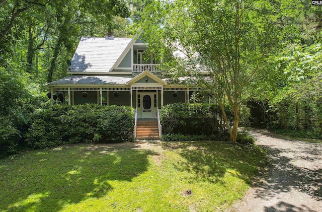1208 Peacehaven Rd, Chapin, SC 29036 - victorian house featuring a front lawn, a porch, and a balcony