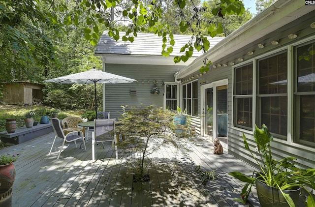 1208 Peacehaven Rd, Chapin, SC 29036 - view of patio with a wooden deck, outdoor dining area, and a storage shed