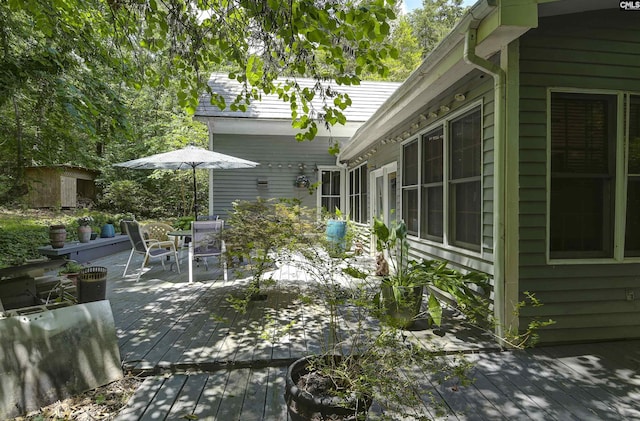 1208 Peacehaven Rd, Chapin, SC 29036 - view of patio with a deck, outdoor dining area, and a shed