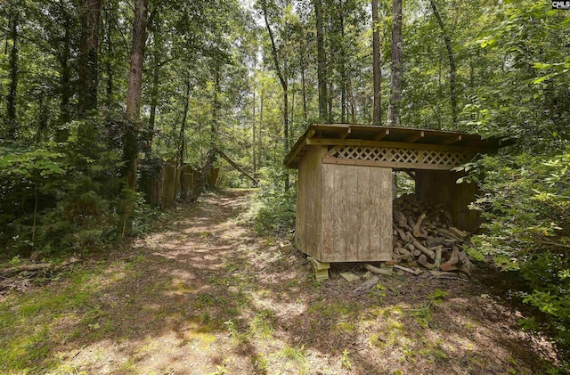 1208 Peacehaven Rd, Chapin, SC 29036 - view of outdoor structure featuring a forest view