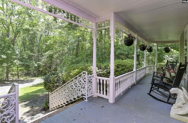 1208 Peacehaven Rd, Chapin, SC 29036 - covered porch featuring a forest view