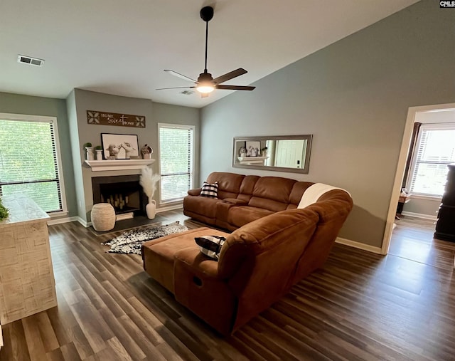 448 Deerwood St Unit 6F, Columbia, SC 29205 - living room featuring dark wood finished floors, ceiling fan, a fireplace with flush hearth, and lofted ceiling
