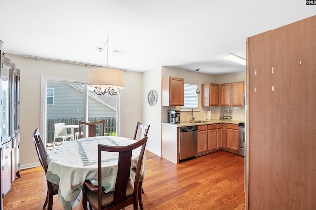 140 Springhaven Dr, Columbia, SC 29210 - dining space with light wood finished floors and a chandelier