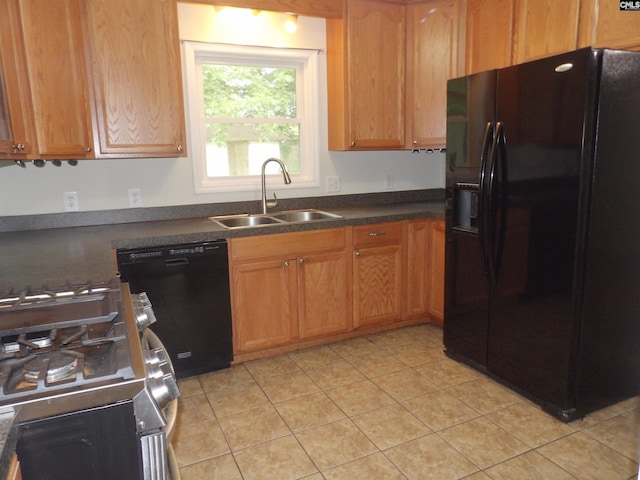 1016 Willis St, Batesburg, SC 29006 - kitchen featuring black appliances, dark countertops, and light tile patterned floors