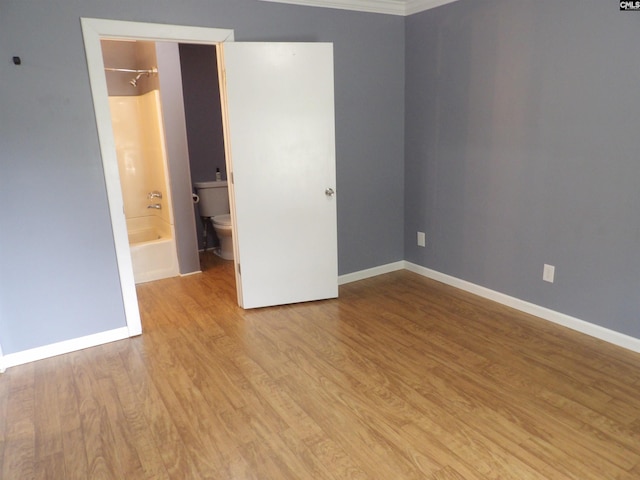 1016 Willis St, Batesburg, SC 29006 - unfurnished bedroom with wood finished floors and connected bathroom