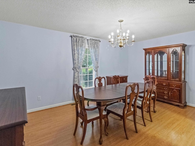 302 Brown St, Prosperity, SC 29127 - dining room with a chandelier, light wood-type flooring, and a textured ceiling