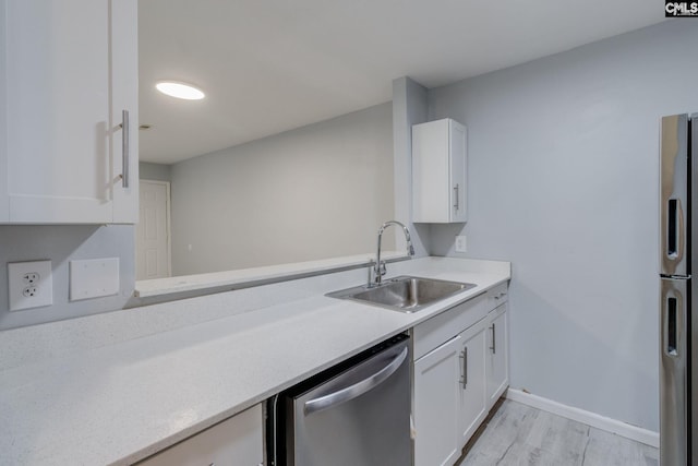 1320 Piney Grove Rd Unit 3C, Columbia, SC 29210 - kitchen featuring stainless steel dishwasher, light countertops, freestanding refrigerator, and light wood-style flooring