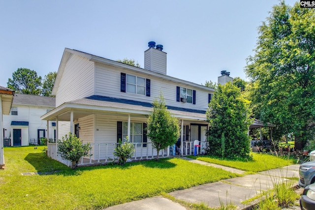 1320 Piney Grove Rd Unit 3C, Columbia, SC 29210 - view of front facade featuring a porch, a front lawn, and a chimney