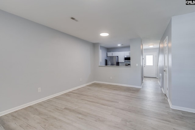 1320 Piney Grove Rd Unit 3C, Columbia, SC 29210 - unfurnished living room featuring light wood finished floors and recessed lighting