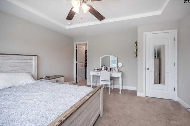 230 Eascott Pl, Columbia, SC 29229 - bedroom with light colored carpet, a raised ceiling, a ceiling fan, and a walk in closet