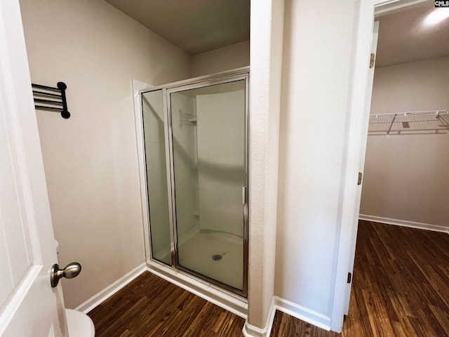 1406 Native Garden Rd, Gilbert, SC 29054 - full bath with wood finished floors, a shower stall, and a walk in closet