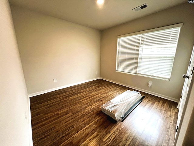 1406 Native Garden Rd, Gilbert, SC 29054 - spare room featuring baseboards and dark wood-style flooring
