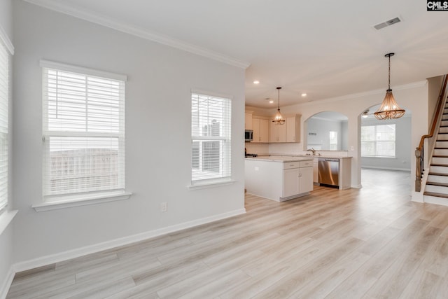 508 Esaw Dr, Elgin, SC 29045 - kitchen featuring stainless steel appliances, arched walkways, ornamental molding, recessed lighting, and open floor plan
