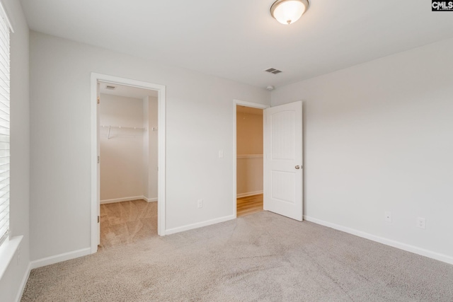 508 Esaw Dr, Elgin, SC 29045 - unfurnished bedroom with carpet flooring, a spacious closet, and a closet