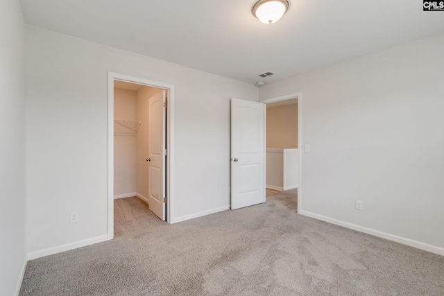 508 Esaw Dr, Elgin, SC 29045 - unfurnished bedroom featuring carpet flooring, a walk in closet, and a closet