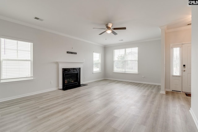 508 Esaw Dr, Elgin, SC 29045 - unfurnished living room with a ceiling fan, a fireplace, ornamental molding, healthy amount of natural light, and light wood-style floors