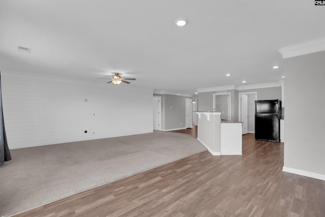 239 Common Reed Dr, Gilbert, SC 29054 - unfurnished living room with ornamental molding, recessed lighting, ceiling fan, and wood finished floors