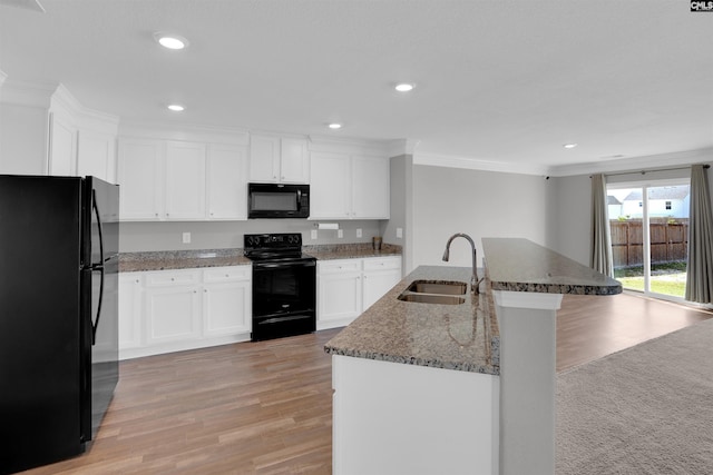 239 Common Reed Dr, Gilbert, SC 29054 - kitchen featuring black appliances, ornamental molding, light wood-type flooring, stone countertops, and recessed lighting