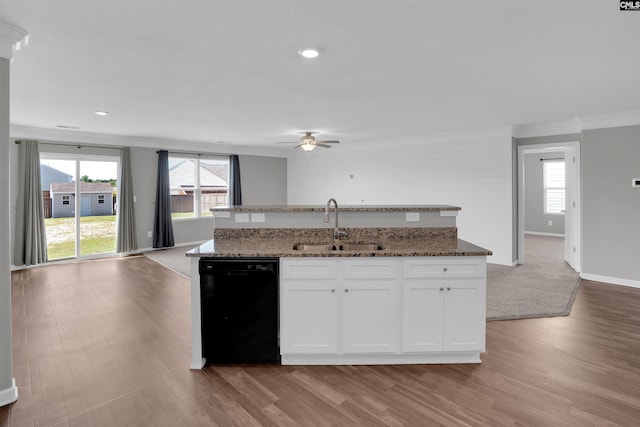 239 Common Reed Dr, Gilbert, SC 29054 - kitchen with black dishwasher, a ceiling fan, open floor plan, light wood-type flooring, and ornamental molding