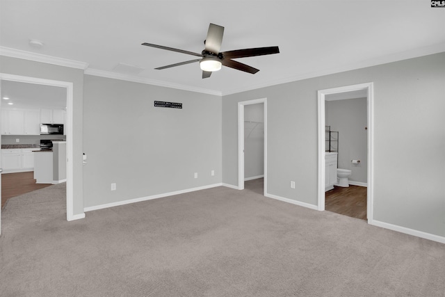 239 Common Reed Dr, Gilbert, SC 29054 - unfurnished bedroom featuring carpet floors, ornamental molding, a spacious closet, ensuite bathroom, and ceiling fan