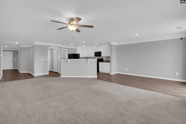 239 Common Reed Dr, Gilbert, SC 29054 - unfurnished living room with recessed lighting, ceiling fan, crown molding, carpet, and wood finished floors
