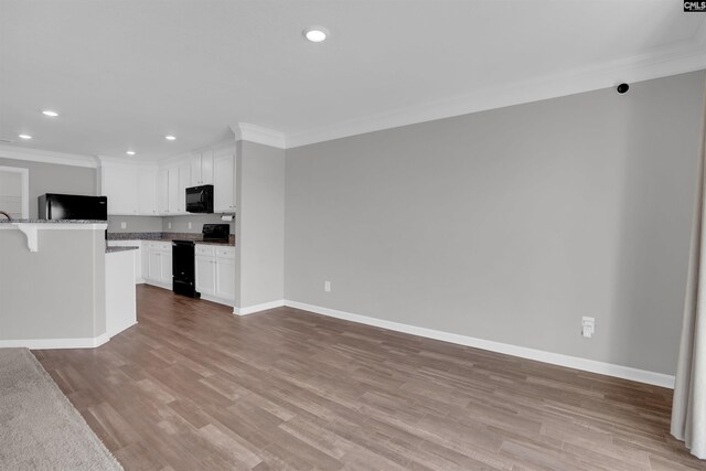 239 Common Reed Dr, Gilbert, SC 29054 - kitchen featuring black appliances, crown molding, recessed lighting, white cabinetry, and light wood-type flooring