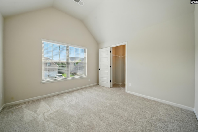 129 River Bridge Ln, Lexington, SC 29073 - unfurnished bedroom with carpet, vaulted ceiling, and a spacious closet