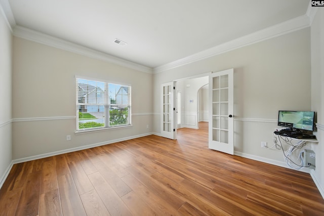 129 River Bridge Ln, Lexington, SC 29073 - unfurnished living room featuring french doors, ornamental molding, and hardwood / wood-style flooring