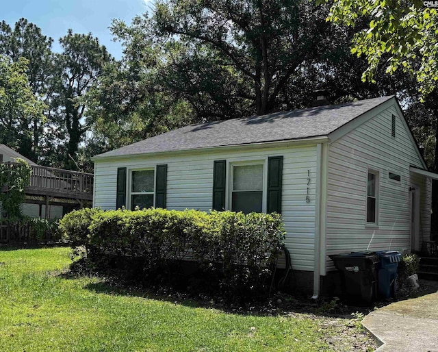 1715 Lacy St, Columbia, SC 29169 - view of home's exterior with a yard and roof with shingles