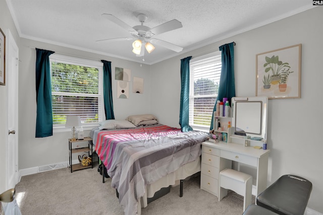 1715 Lacy St, Columbia, SC 29169 - bedroom with multiple windows, ornamental molding, light colored carpet, a ceiling fan, and a textured ceiling