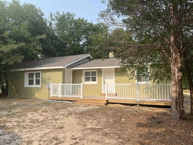 309 Shelton Rd, West Columbia, SC 29170 - single story home with a chimney, a shingled roof, and stucco siding