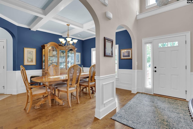 699 Village Market Dr, Chapin, SC 29036 - entrance foyer featuring arched walkways, beamed ceiling, coffered ceiling, healthy amount of natural light, and wainscoting