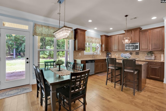 699 Village Market Dr, Chapin, SC 29036 - dining space featuring a chandelier, light wood-style flooring, ornamental molding, and recessed lighting