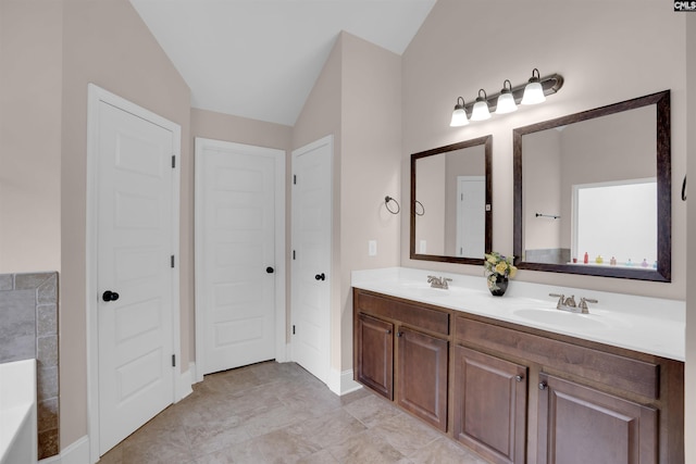 699 Village Market Dr, Chapin, SC 29036 - bathroom with double vanity, vaulted ceiling, and a tub