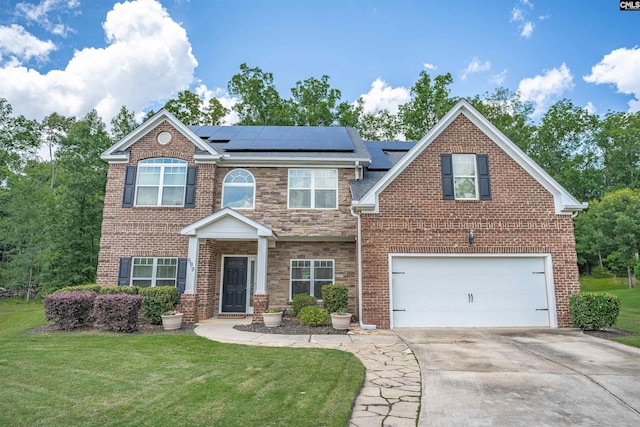 699 Village Market Dr, Chapin, SC 29036 - view of front of property with an attached garage, a front lawn, driveway, and roof mounted solar panels