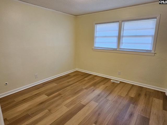 1712 Omarest Dr, Columbia, SC 29210 - unfurnished room with ornamental molding, wood finished floors, and a textured ceiling
