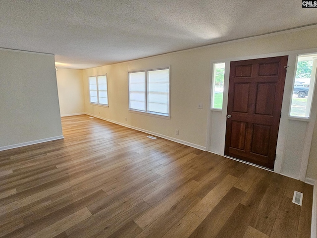 1712 Omarest Dr, Columbia, SC 29210 - entrance foyer featuring wood finished floors and a textured ceiling