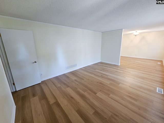 1712 Omarest Dr, Columbia, SC 29210 - empty room featuring light wood-style flooring and a textured ceiling