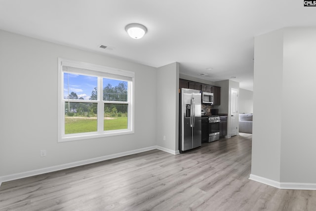 465 Vanburen Ct, Gaston, SC 29053 - unfurnished living room with baseboards and light wood-type flooring